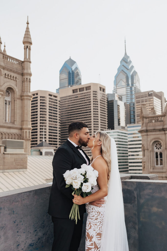 A romantic rooftop escape captures the essence of Danielle and Dominic's love story with the iconic Philadelphia skyline as a breathtaking backdrop.