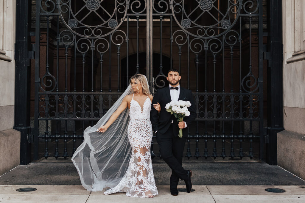 Danielle's dress becomes a work of art against the classic backdrop of Philadelphia's City Hall during this engagement session.