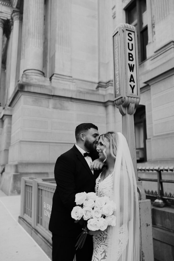 Philadelphia's iconic City Hall serves as a romantic stage for Danielle and Dominic, highlighting the architectural beauty of the city in their engagement photos.