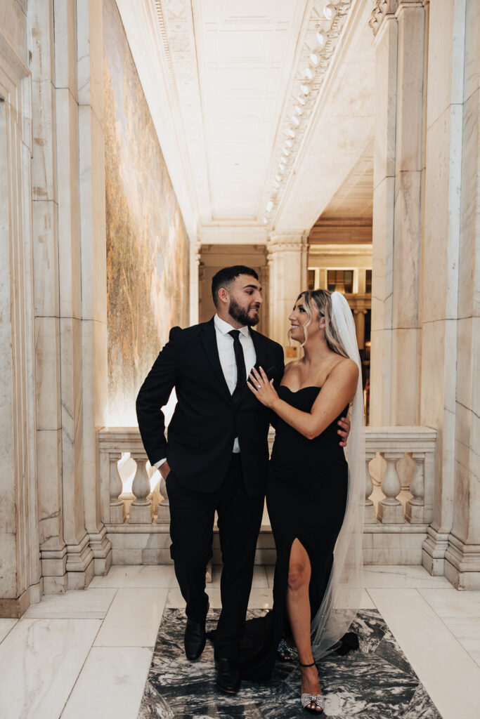 In the heart of Philadelphia, Danielle's black dress takes center stage at The Curtis, creating an elegant and stylish engagement photo.