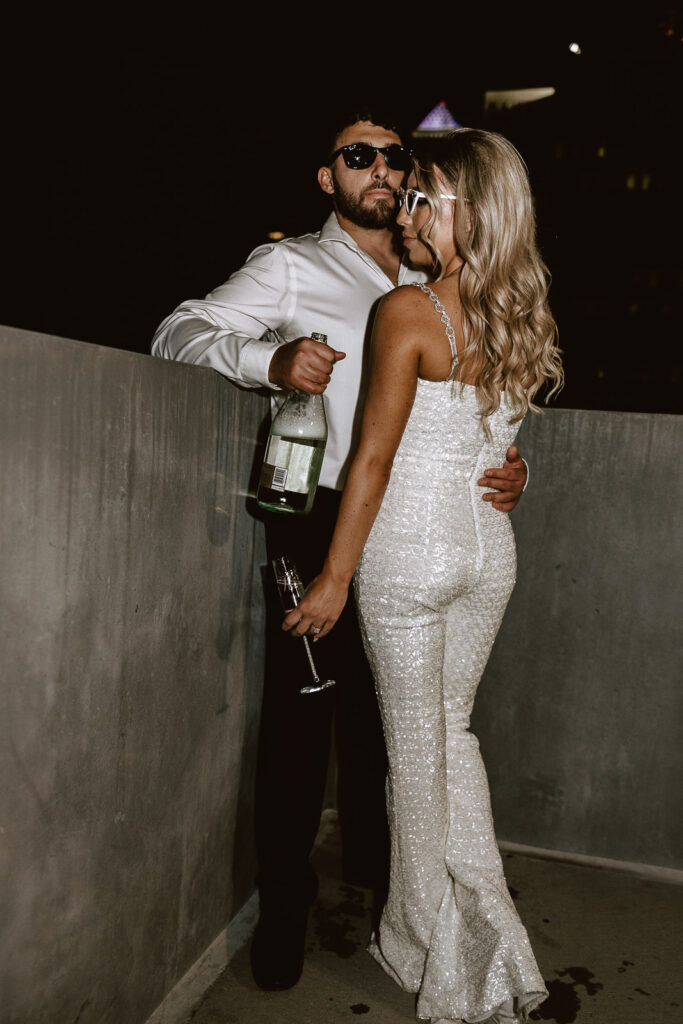 The sparkle of champagne and the flash of the camera illuminate Danielle and Dominic's love, creating a dazzling moment in their Philadelphia engagement photos.