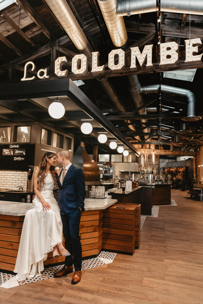 bride and groom posing nose to nose at la colombe coffee