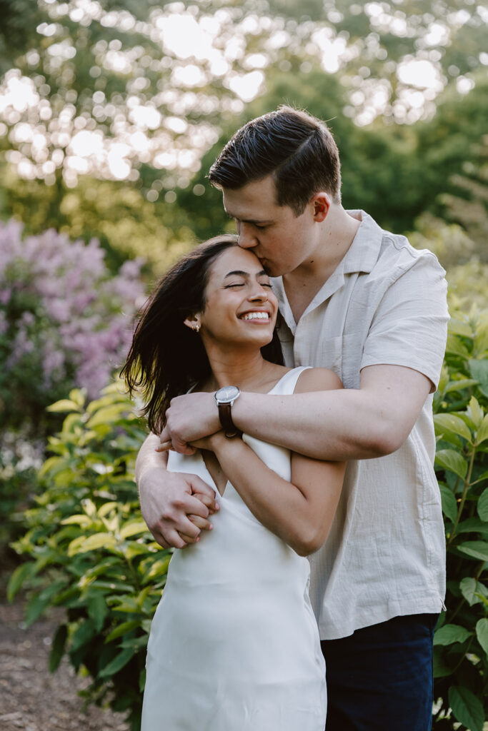 couple embracing at Rodin Museum for their engagement photos in Philadelphia