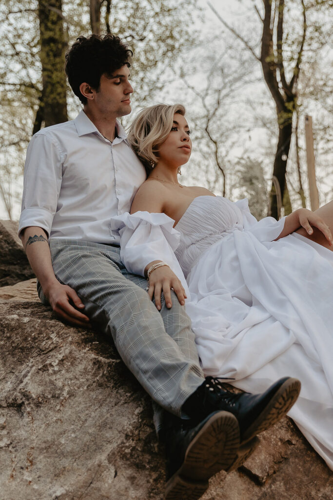 bride and groom cuddling on a rock for their pennsylvania elopement