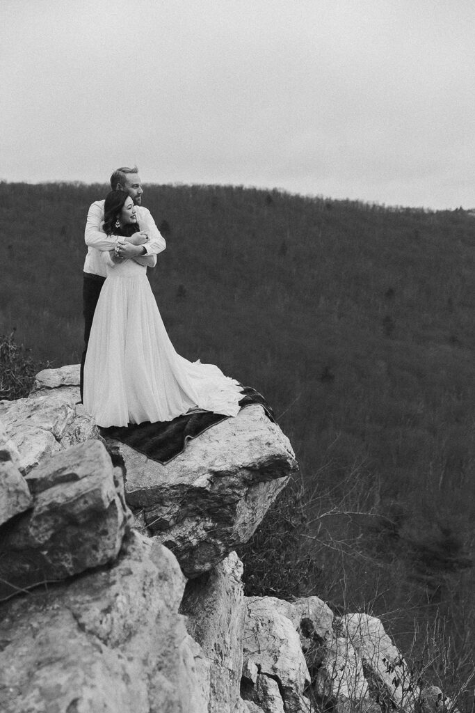 bride and groom embracing at hawk mountain sanctuary for their pennsylvania elopement