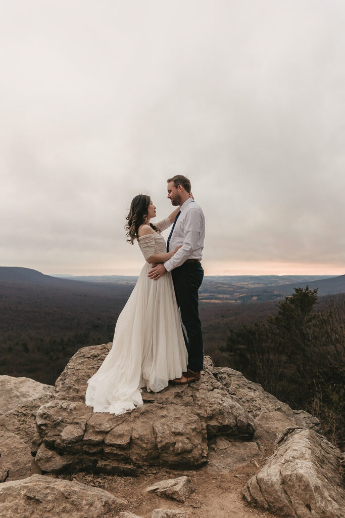 bride and groom looking at the blue ridge mountains at hawk mountain sanctuary for their pennsylvania elopement