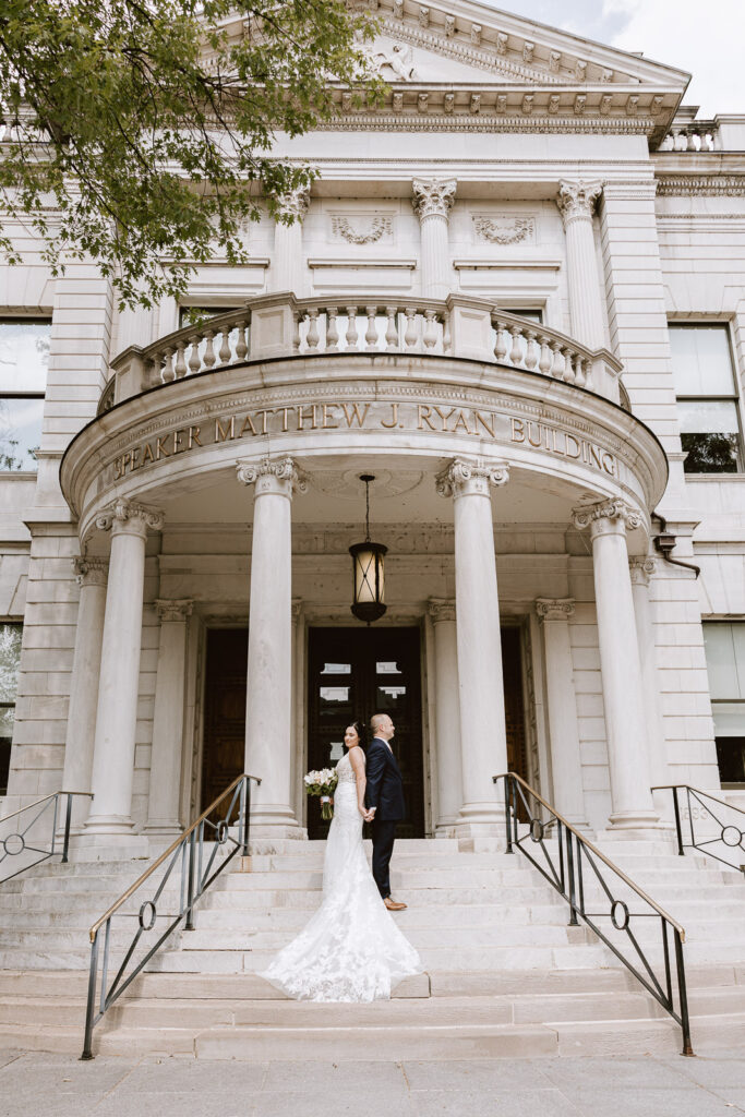 bride and groom outside of the Pennsylvania State Capitol for their Pennsylvania elopement