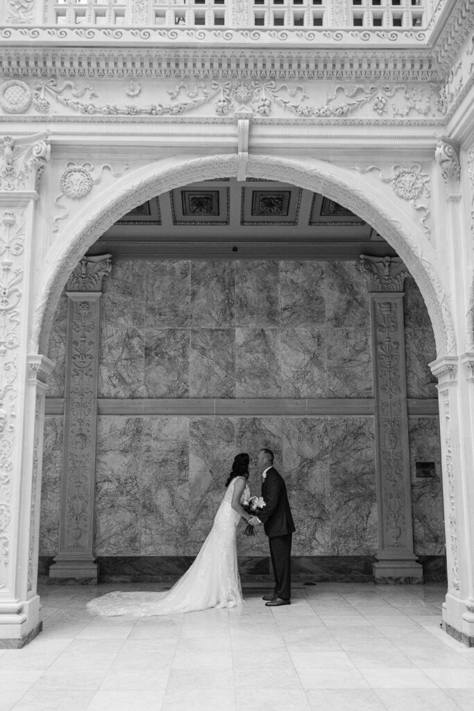 bride and groom kissing inside the Pennsylvania State Capitol for their Pennsylvania elopement