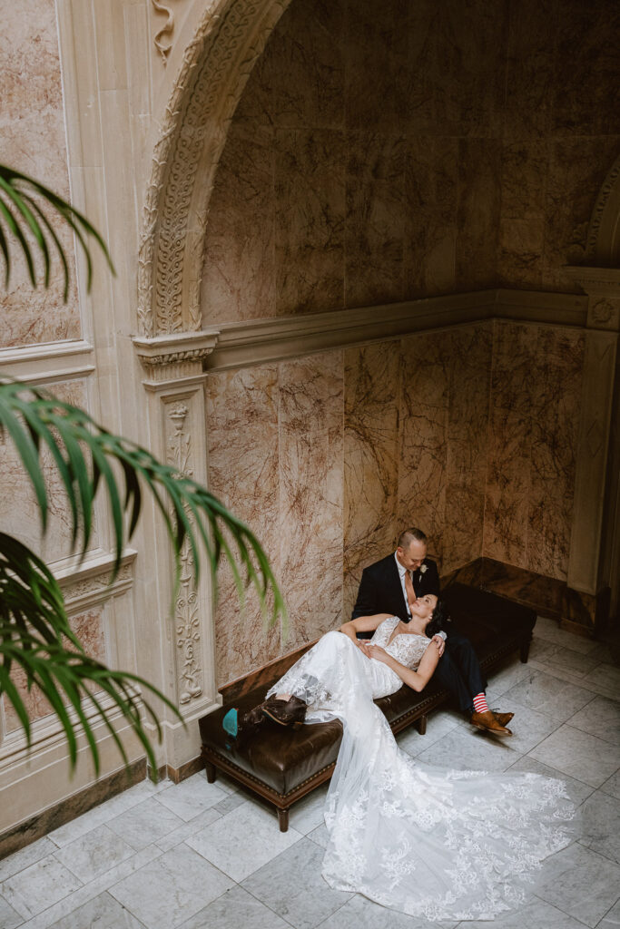 bride and groom embracing at the Pennsylvania State Capitol for their Pennsylvania elopement
