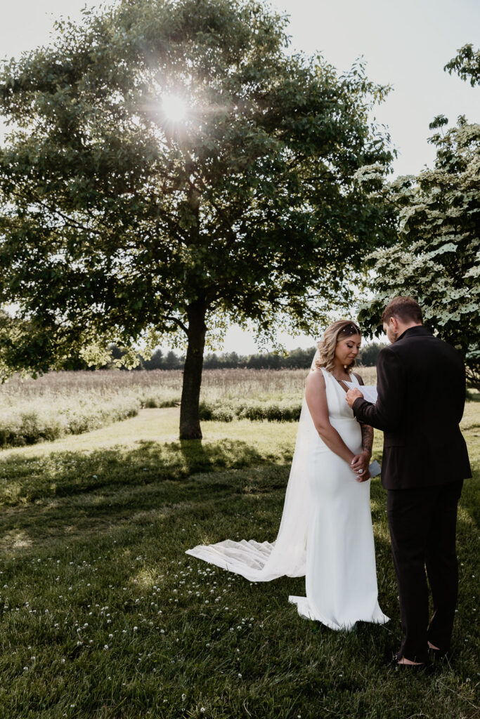 bride and groom exchanging vows at wyomissing park for their pennsylvania elopement
