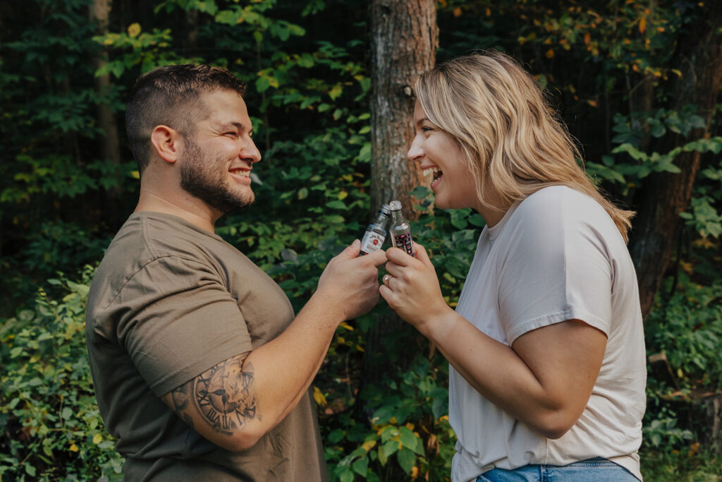 couple enjoying a shot together at their outdoor engagement photos in pa