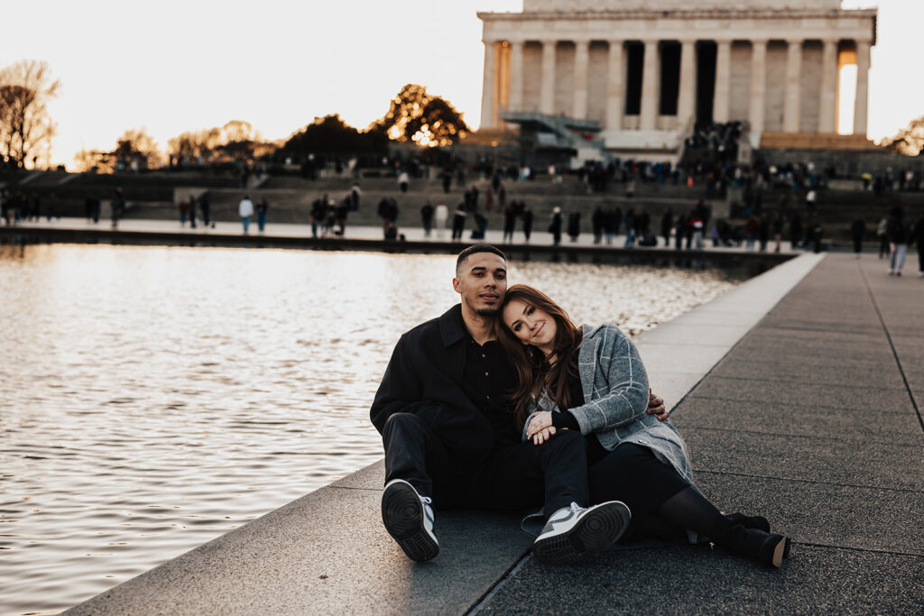 A joyful couple’s engagement photos in historic Washington DC, posing in front of classic architecture and city landmarks.