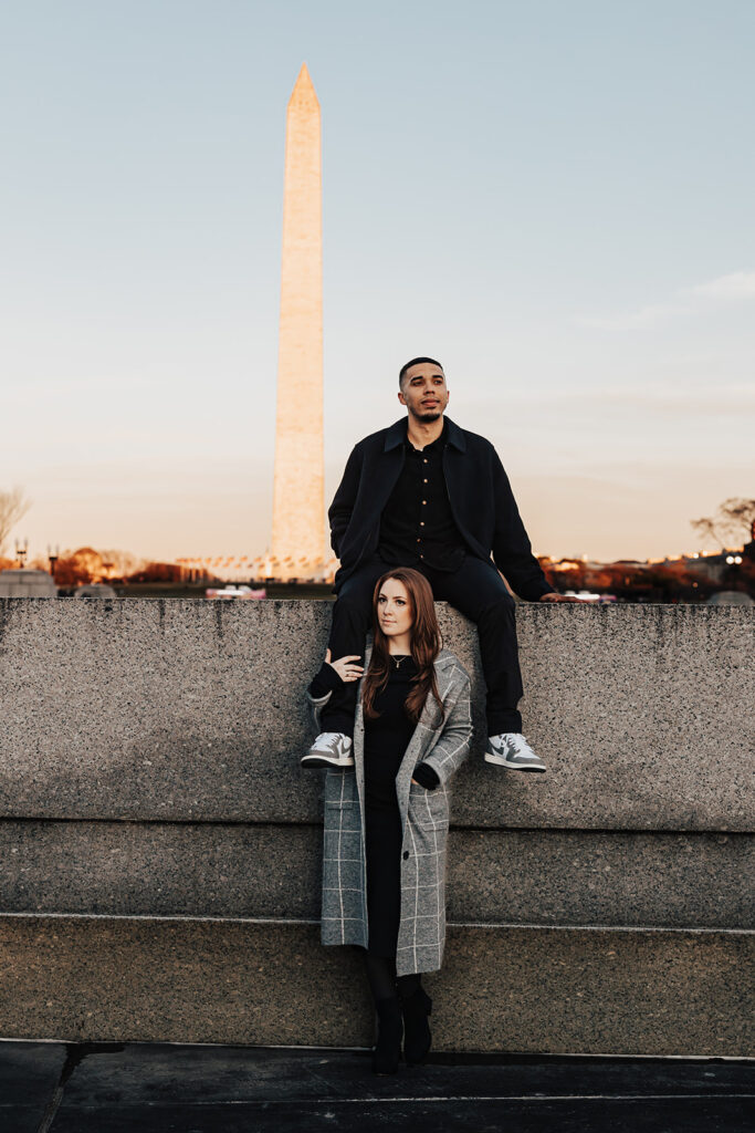 A joyful couple’s engagement photos in historic Washington DC, posing in front of classic architecture and city landmarks.